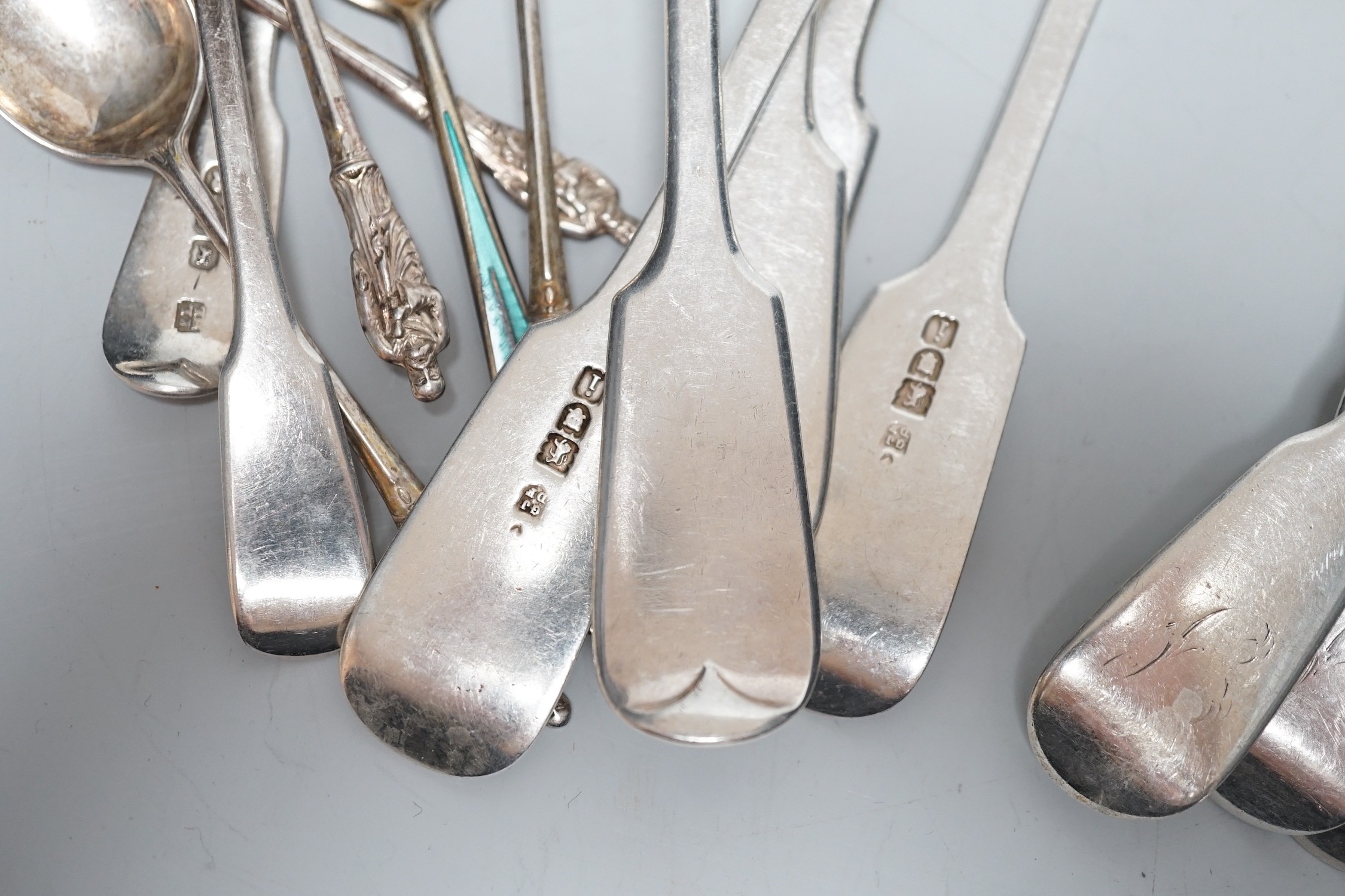A small quantity of George III and later silver fiddle pattern and other cutlery, various dates and makers, 20.6oz.